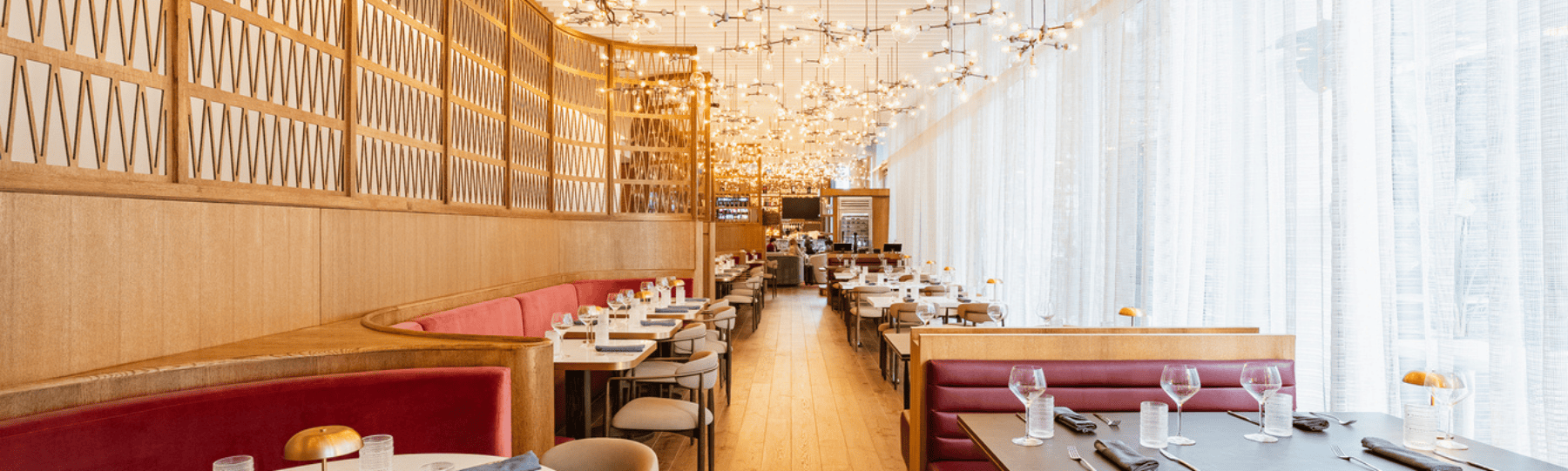 Cozy window-side dining setup at Astra Kitchen & Lounge